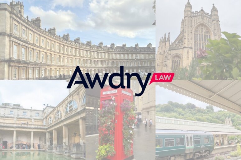 Collage-style promotional image featuring six photographs surrounding the central logo of "Awdry LAW." The logo displays "Awdry" in dark blue and "LAW" in white text on a pink background. Surrounding images include: the Georgian Royal Crescent, Bath Abbey’s Gothic architecture, the Roman Baths with classical columns, a red British telephone booth decorated with flowers, and a green train at a station with a hilly landscape. The collage highlights iconic landmarks of Bath, suggesting Awdry LAW’s regional presence and cultural connection.