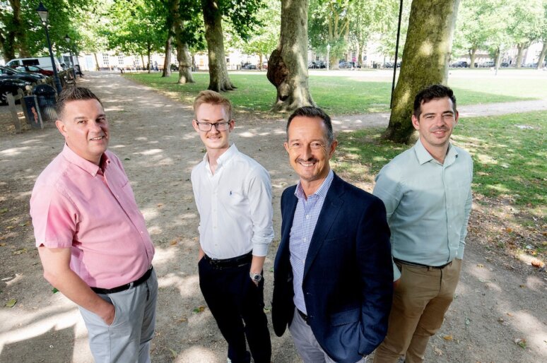 FW Capital Bristol. Kevin Goodall (far left) with the team- Kevin is wearing a pink shirt and the photo is taken in a park